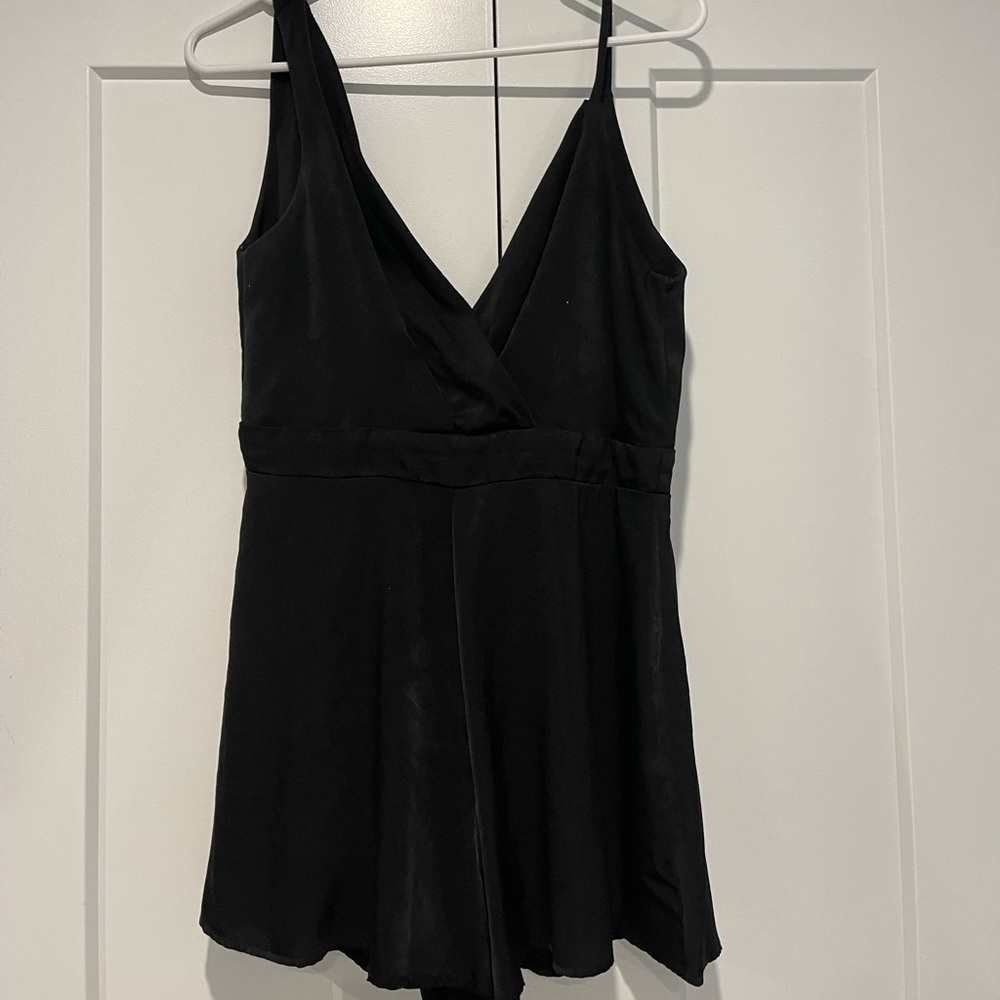 Black asymmetrical women’s zip up romper